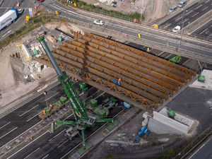 A large crane was used to lower the beams into place. Photo: Paul Turner