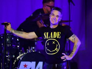 Supporting image for story: Robbie Williams superfan from Wolverhampton is reunited with Rock DJ singer on stage at The Halls