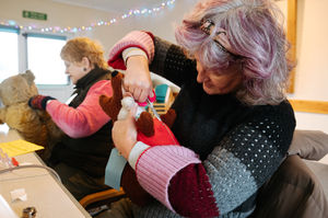 Mandy Furniss sewing up an old Basil the Brush