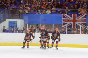 Players and fans celebrate Joe Aston's goal.