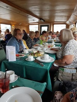 Ladies enjoying an outing and lunch on a canal barge 