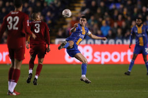 Fabinho of Liverpool and Oliver Norburn of Shrewsbury Town (AMA)
