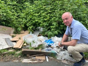 Former MP Marco Longhi with rubbish dumped in Angel Street, Dudley