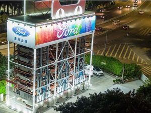 Supporting image for story: A city in China now has a giant vending machine dishing out cars