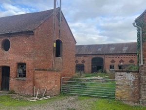 Supporting image for story: Plans to turn empty farm buildings into eight family homes submitted