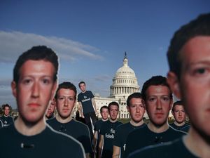 Supporting image for story: 100 life-size cutouts of Mark Zuckerberg have been placed on the Capitol lawn in Washington