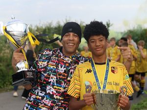 Supporting image for story: Young footballer celebrates historic treble win and continues to impress top clubs