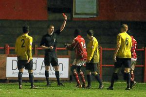 The match referee shows Alberton Saidi of Workington a red card for a push on Matty McGinn of AFC Telford United
