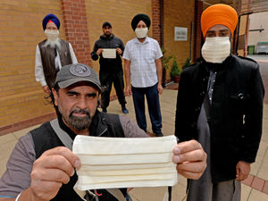Supporting image for story: Wolverhampton gurdwara making hair-friendly masks for bearded police officers