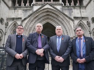 Former students of Treloar’s School (left to right) Adrian Goodyear, Richard Warwick, Steve Nicholls, and Gary Webster, outside the Royal Courts of Justice in London