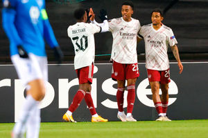 Arsenal's Reiss Nelson, right, celebrates taking the score to 0-2, with Joe Willock, centre, and Eddie Nketiah