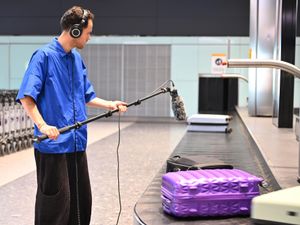 Musician Jordan Rakei recording the sound of a baggage belt at Heathrow airport