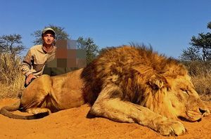 Mr Goss with a dead lion