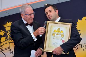 Hugh Porter presents an award to Wolves MD Laurie Dalrymple, who was there on behalf of Ron Flowers