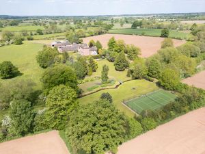 The property boasts just under nine acres of land with beautiful formal gardens, a range of outbuildings, a lake and a tennis court. Picture: Rightmove/Savills.