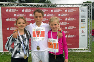 Iona Rathbonehis, Brook and Molly Rogers  team winning the triathlon at Cholmondeley in June