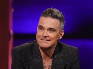Supporting image for story: Robbie Williams reveals he sees himself in Harry Styles