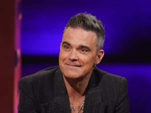 Supporting image for story: Robbie Williams reveals he sees himself in Harry Styles