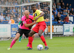 Gareth Roberts of Stockport County and Amadou Bakayoko of AFC Telford United