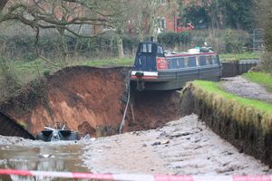 Three boats became caught up by the 50-square-metre sinkhole which developed at 4.22am today. Photo: Anita Maric/SWNS