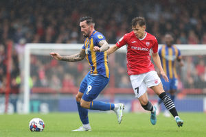 Ryan Bowman of Shrewsbury Town and Jake Taylor of Morecambe (AMA)