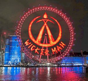 Wicker Man burning logo projected onto the London Eye
