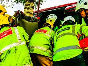 Supporting image for story: Woman trapped after rolling car