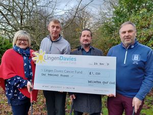 Supporting image for story: Golfers hand over charity cheque