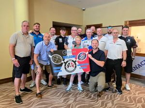 Councillors Adam Davies and Wayne Little, with Shane Birch Bastock (Brierley Hill Community Forum), business partners, ambassadors and others at the Junior Darts Academy fun day at the Copthorne Hotel, Brierley Hill
