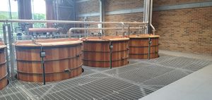 The distillery section is set over two floors and is very warm and very noisy