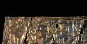 Part of the helmetband, depicting a frieze of warriors