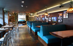 Live sport is shown on screens throughout the bar