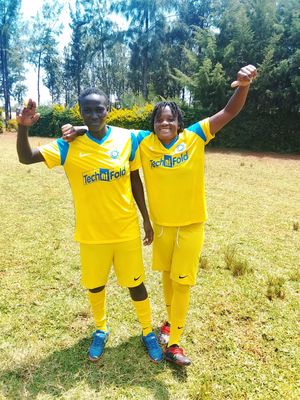 Young people in Kenya showing off their new kits.