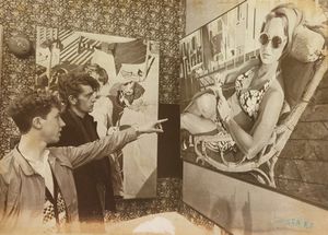 'The Swimmers', Wednesbury Art Gallery. Les Willock put on a display of his paintings as part of the Sandwell Arts Spring and Summer programme. The photograph shows Chris Brittan and Kevin Knowles admiring a painting on April 19, 1983.