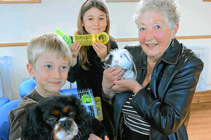 At the pet service are Sarah Higgins with Pebbles, Brenda Vanstone with Gizmo the guinea pig and Jamie Higgins with Jake
