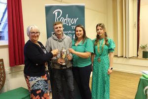 Radnor YFC President, Sharon Hammond presenting the Trevaughan trophy to Ben Davies and Sian Davies of Edw Valley YFC accompanied by County Chair, Elizabeth Swancott.

 