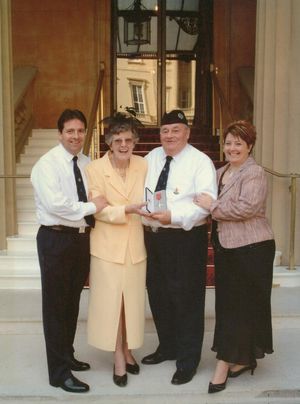 Ian Sharp, left, joining his dad Donald when he collected his MBE. Photo: Ian Sharp