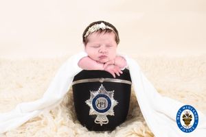 Isla-Rose in a police hat. Photo: West Midlands Police