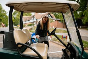 Golfers returning to the course at Lilleshall Hall Golf Club after Coronavirus Pandemic Lockdown measures begin to be lifted. In Picture: Lisa Shervill (Pro Golfer) cleaning the buggies ready for the volunteer marshalls.