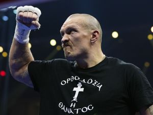 Oleksandr Usyk celebrates his win over Tyson Fury