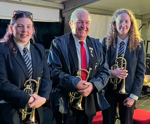 Music down the generations... Paul France of Madeley, the longest serving musician with Jackfield Brass Band, with granddaughters Lily and Eleanor, who play with Wellington Band. 