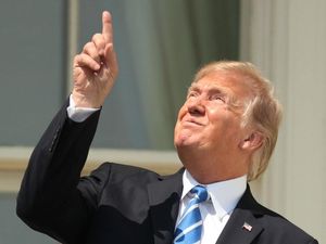 Supporting image for story: The best reactions to Donald Trump looking directly at the Sun during the eclipse