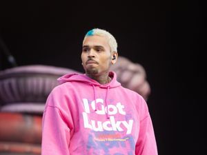 Chris Brown is being held on suspicion of grievous bodily harm, according to reports (James Manning/PA)