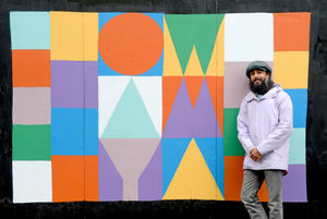 Vik Chandla with his Ow Am Ya artwork
