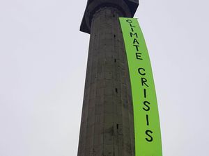 Supporting image for story: Banner raised on Lord Hill's column by climate protesters