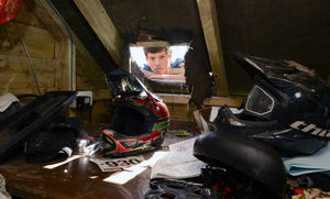 Harry in the hole in the roof of the garage where the thieves broke in