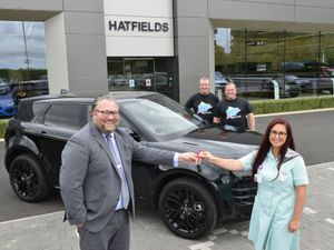 Oliver Benbow hands over the Evoque keys to Annaliza Bottomley watched by Paul Bennett and Dave Prince