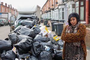 Hawida Osman local resident standing next to rubbish on Percy Road in Sparkhill Birmingham  ahead of Tuesday's 'all out strike'.  