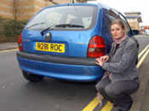 Supporting image for story: Car shifted to paint yellow lines