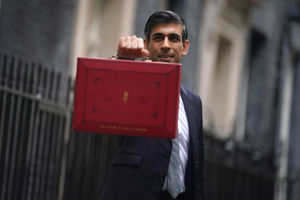 Rishi Sunak holds his 'Red Box' outside 11 Downing Street before delivering his Budget to the Commons